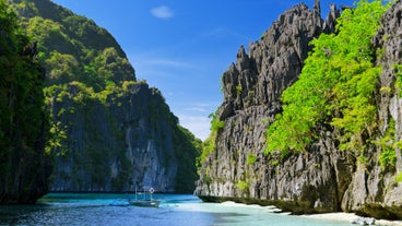 The dramatic rock formations in El Nido town on Palawan Island, a scenic stop in this 3-week vacation package in the Philippines