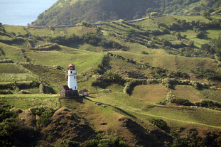 Basco Lighthouse stands as a scenic highlight of your Batanes Island tour package, offering breathtaking coastal views.