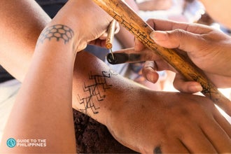 Enjoy a unique tattoo experience on this 2-day tour package to Buscalan Village, where you can be inked by Apo Whang-Od or one of her gifted apprentices
