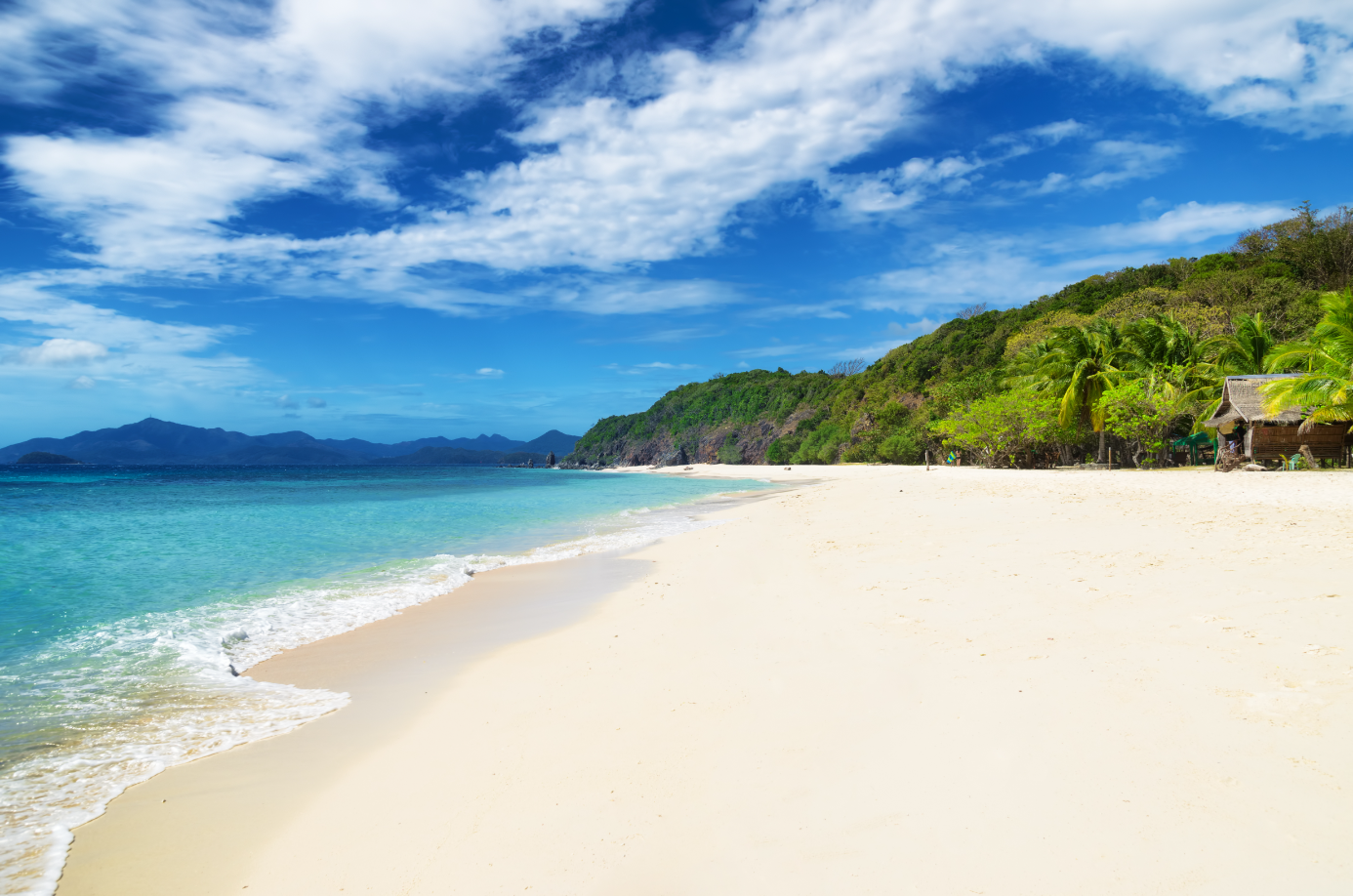 The beautiful view of the pristine white sand of Malcapuya Island, a part of this island hopping tour C in Coron town