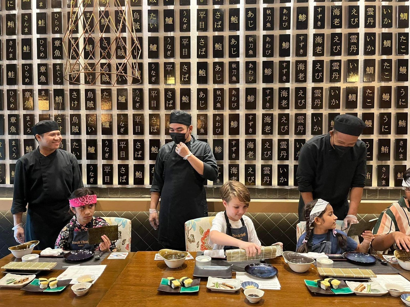 A photo of children in a sushi-making class supervised by professional chefs at Dusit Thani Hotel in Manila City.