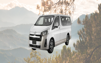 A modern air-conditioned private van used for transfers between Loakan Airport and Baguio City.