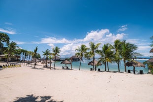 Relax and unwind on the pristine white sand of Bluewater Maribago, the perfect spot for a serene beach day.