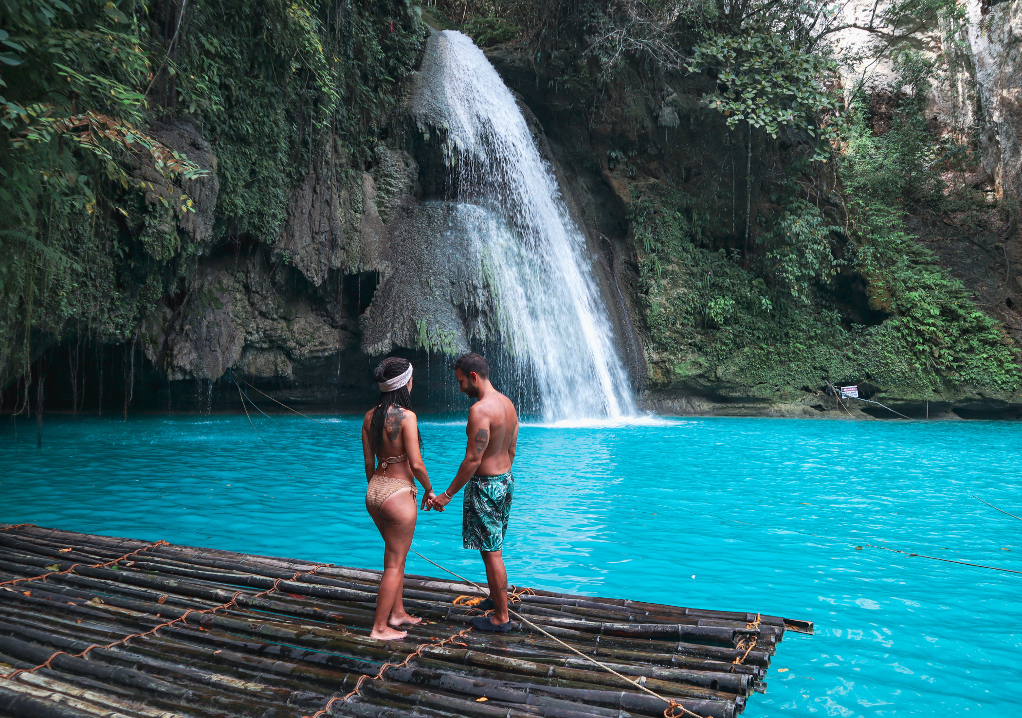 Kawasan Falls, a multi-tiered cascade nestled in the lush mountains of Badian town in Cebu Island Province.