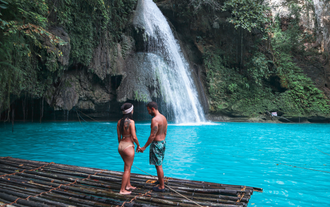 Kawasan Falls, a multi-tiered cascade nestled in the lush mountains of Badian town in Cebu Island Province.