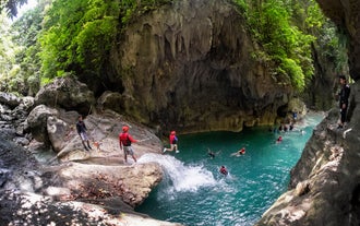 Thrill-seekers in action during a canyoneering activity at Kawasan Falls in Badian town, Cebu Province.