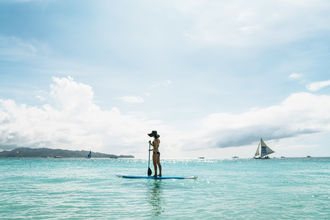 Enjoy a serene paddleboarding adventure in Boracay's paradise.