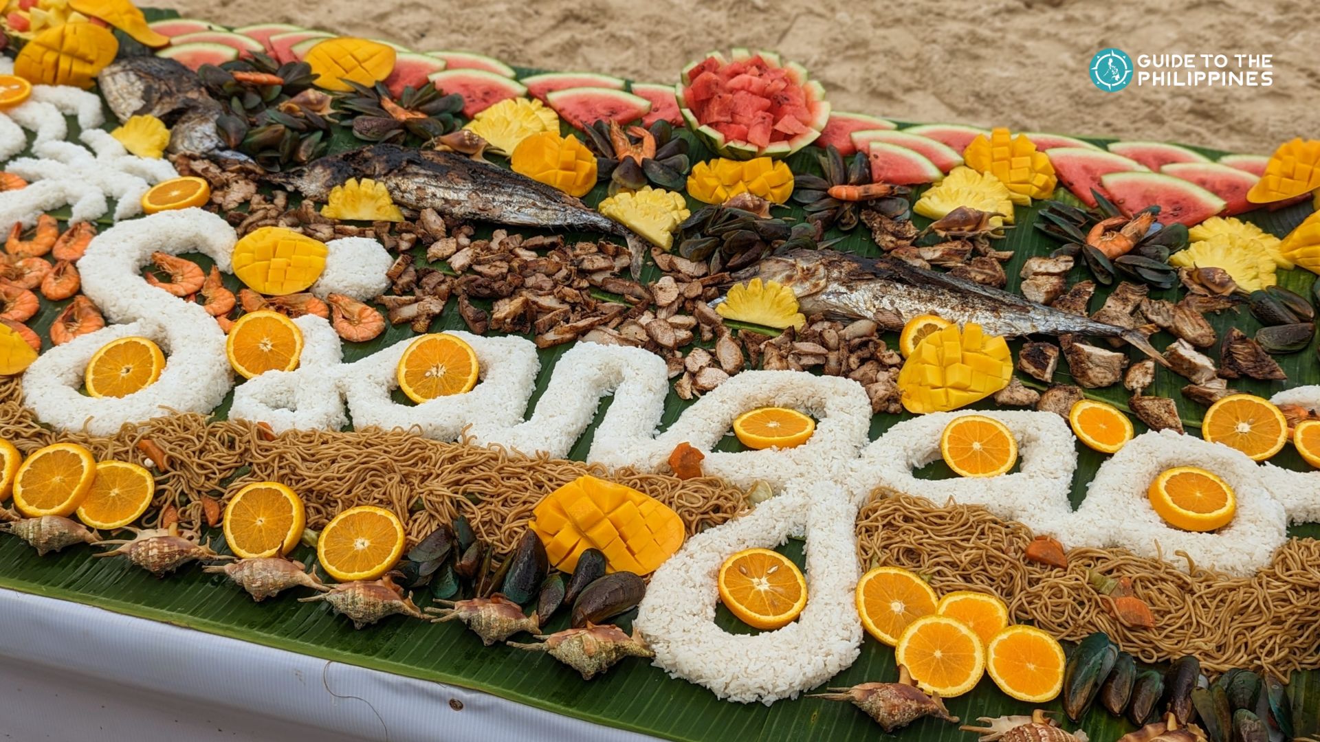 Boodle fight spread in a Siargao island hopping tour
