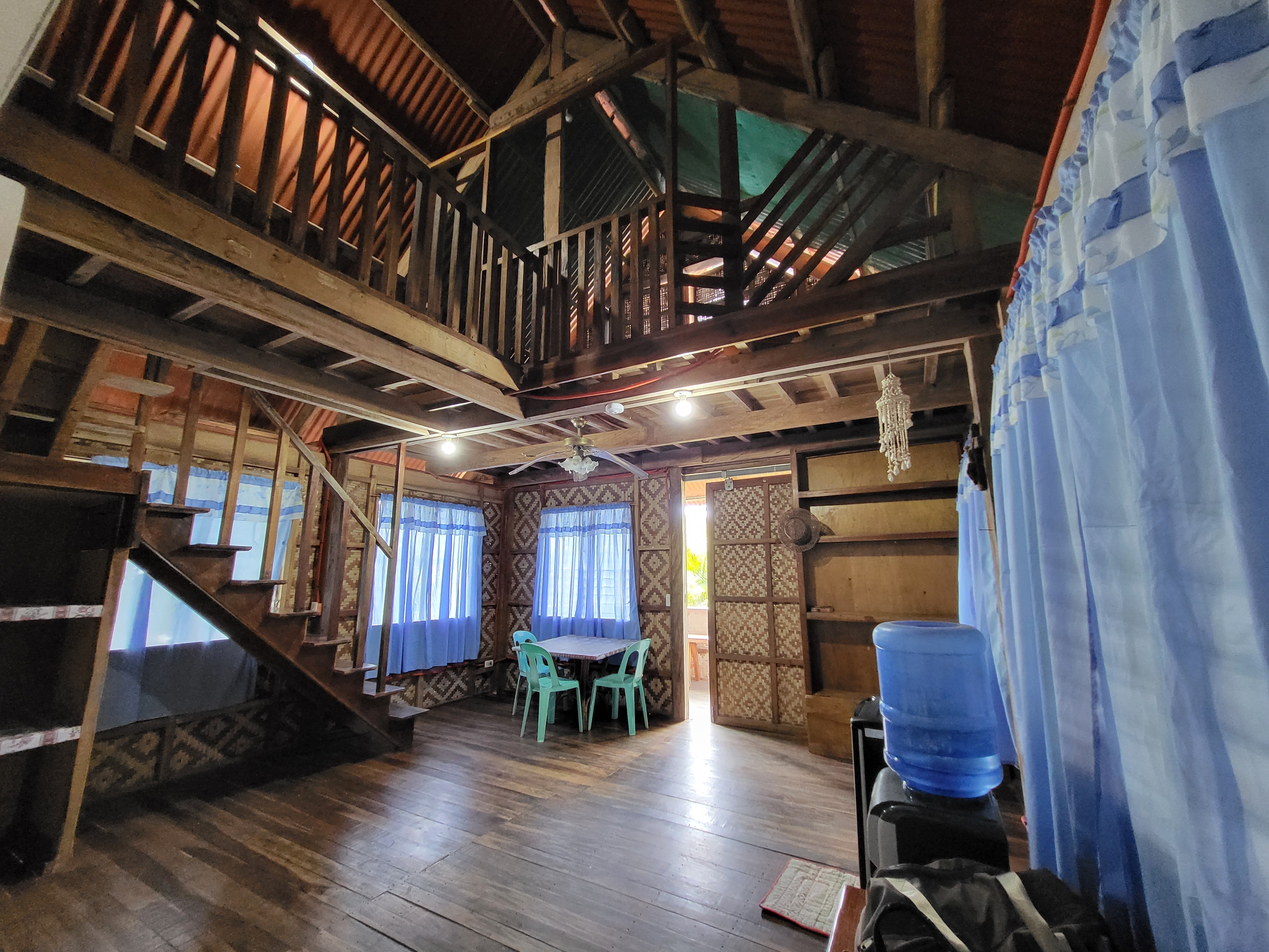 Interior of one of the family-sized native hut-inspired accomodations in Maya's Native Garden Resort in Moalboal town