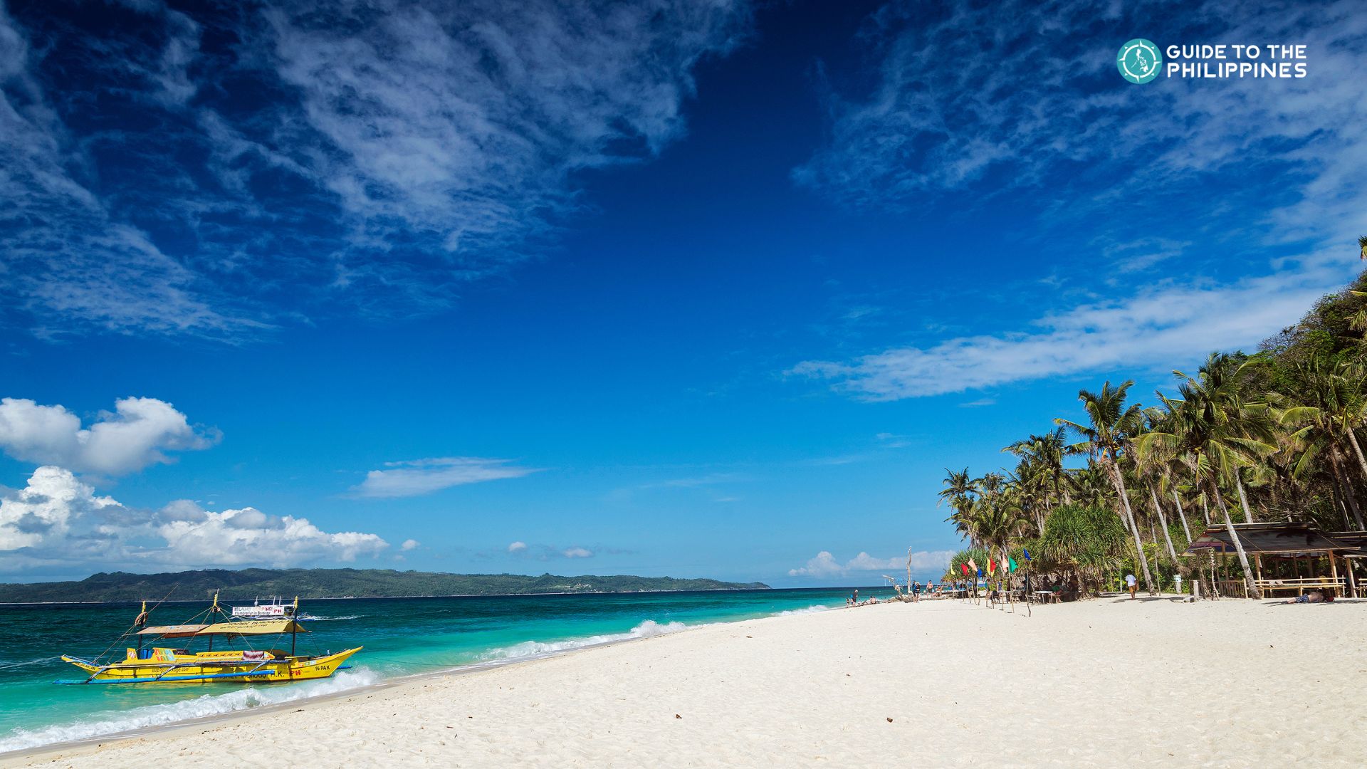 Boat on a Boracay island hopping tour docked by a beach