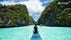 A tourist on a boat during an El Nido island hopping tour in Big Lagoon on Palawan