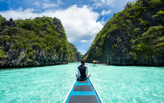Discover the mesmerizing charm of Big Lagoon’s vibrant turquoise waters and dramatic cliffs during your tour package to Puerto Princesa City and El Nido Town on Palawan Island