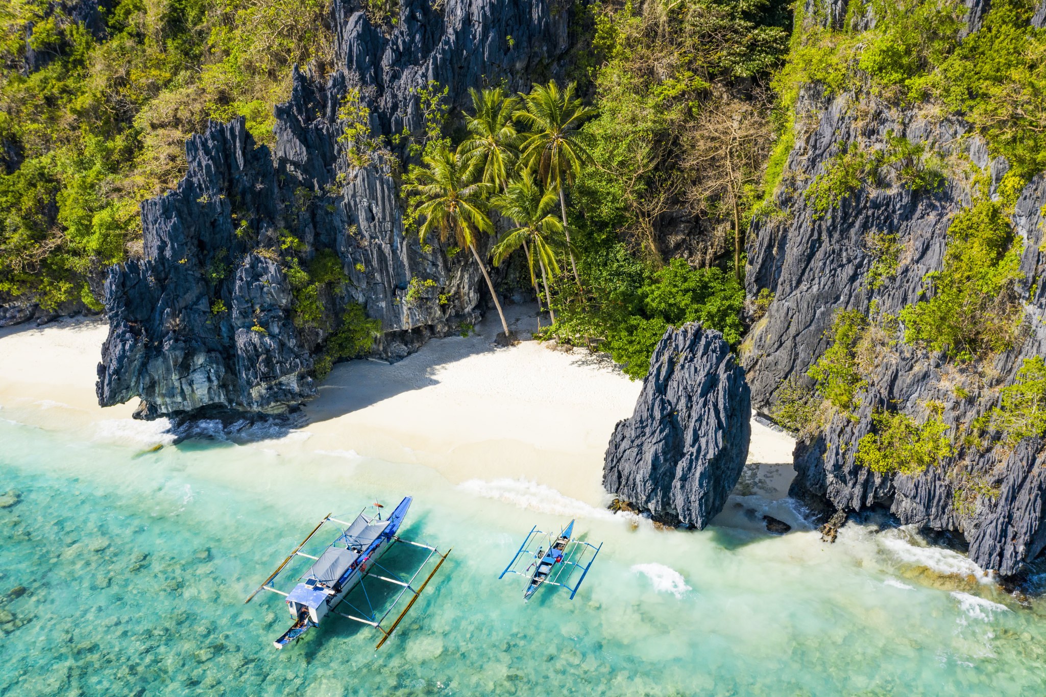 Discover the beauty of Entalula Island, with its pristine white sand beach and crystal-clear waters, as part of this boat tour in El Nido town.