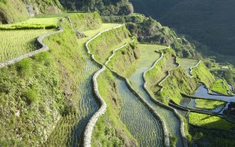 The quaint town of Batad welcomes tourists with scenic views and rich culture, which you can immerse yourself in with this tour package in the municipality of Banaue.
