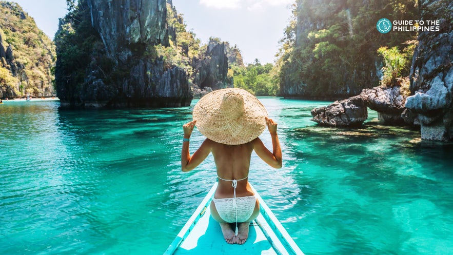 Female traveler on a boat in El Nido, Palawan Female traveler on a boat in El Nido, Palawan