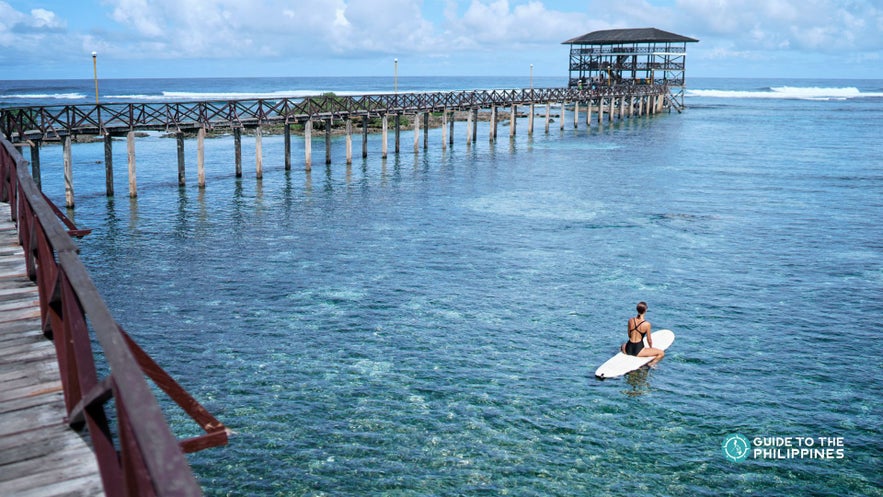A surfer in Siargao's Cloud 9 A surfer in Siargao's Cloud 9