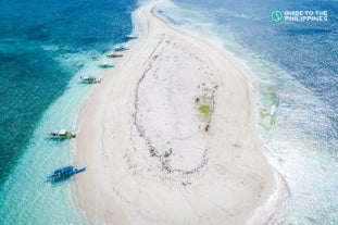 Book this Siargao Island travel package for an unforgettable journey with a guided tour and a surfing session.