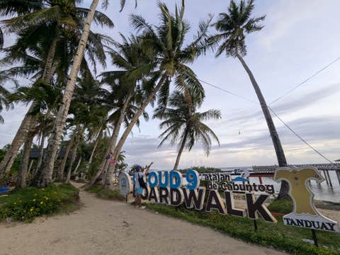 Exciting 4-Day Siargao Island Tour Package at Caracoa Resort with Local Flights & Surfing Lesson