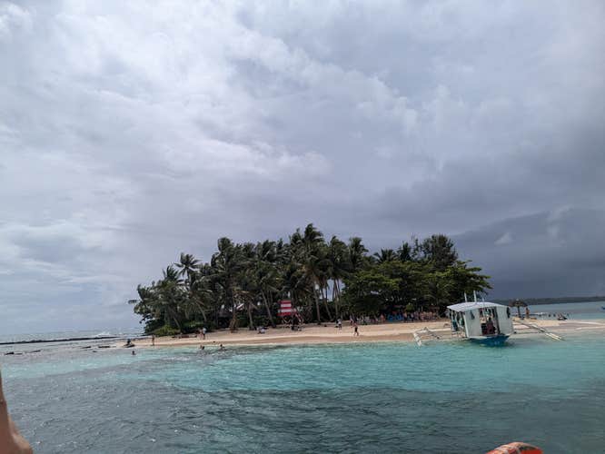 During your Siargao Island tour package, you can discover the charm of Guyam Island, where soft white sands and turquoise waters await.