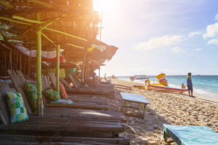 Relax on the serene shores of Puka Beach during this Boracay tour package.