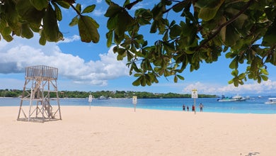 A peaceful beach on Tulang Diot Island, featuring powdery white sand and clear waters, is included in this Camotes Island tour
