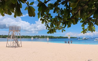 A peaceful beach on Tulang Diot Island, featuring powdery white sand and clear waters, is included in this Camotes Island tour