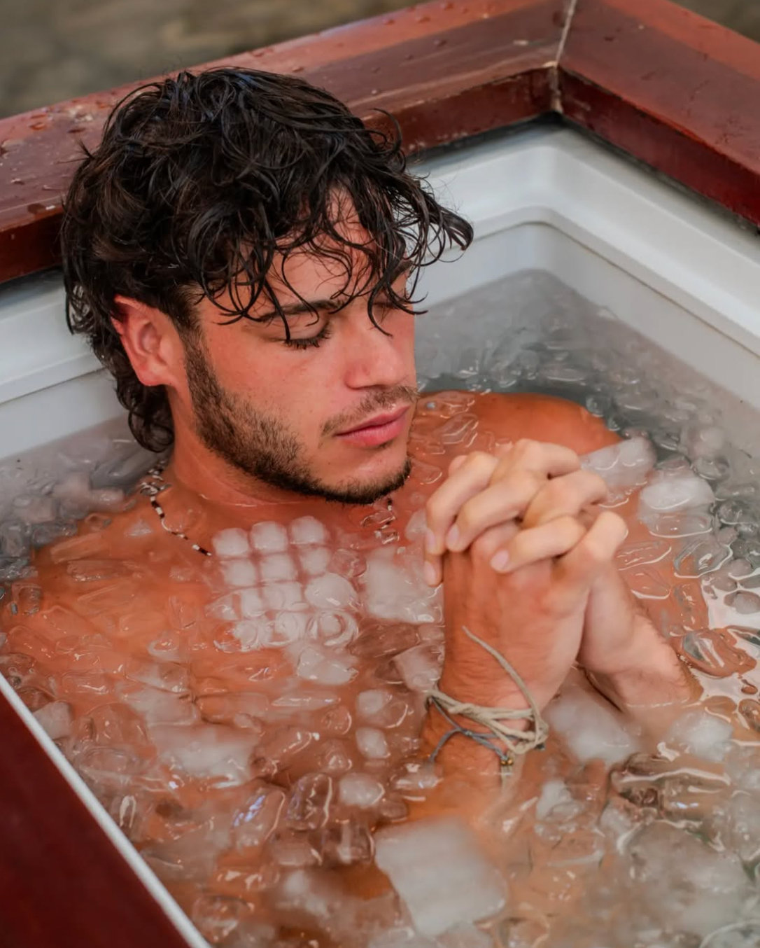 A tourist relaxing in the ice bath in Siargao Island