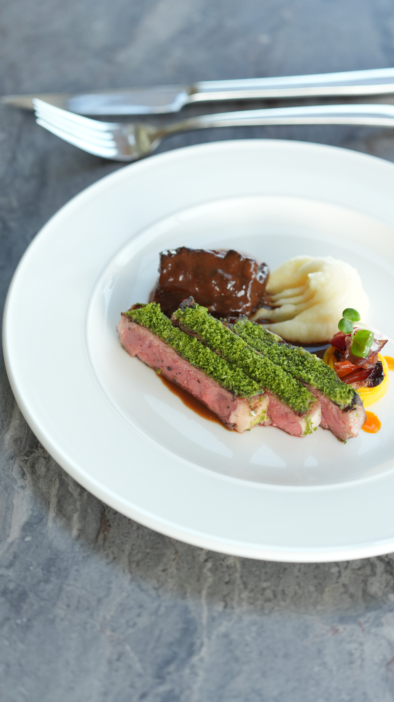 Enjoy the perfectly grilled U.S. Ribeye Prime with tender braised beef cheeks, an entree at Sinta, one of the premier restaurants in Tagaytay City.