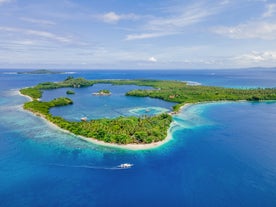 From above, the blue waters of Juag Lagoon Marine Sanctuary show the thriving marine life visited on this Sorsogon Province tour to Subic Beach and other spots in Matnog town.