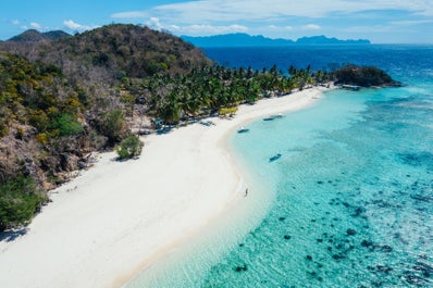 Try island hopping to Kayangan Lake in Coron