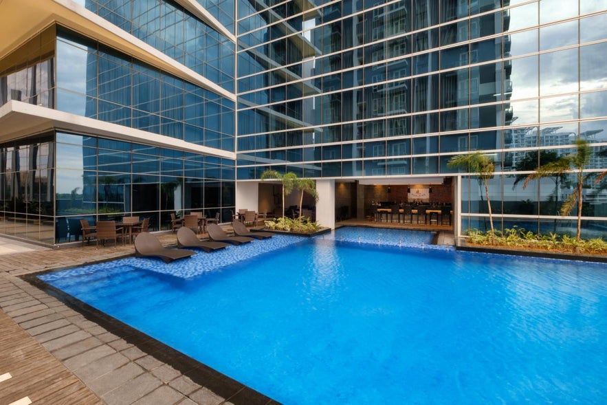 A view of the swimming pool of Savoy Hotel Mactan Newtown, one of the top hotels near Cebu Airport. A view of the swimming pool of Savoy Hotel Mactan Newtown, one of the top hotels near Cebu Airport.