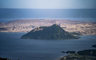 A scenic view of Taal Lake and Taal Volcano that is best seen during a Tagaytay City highlands tour