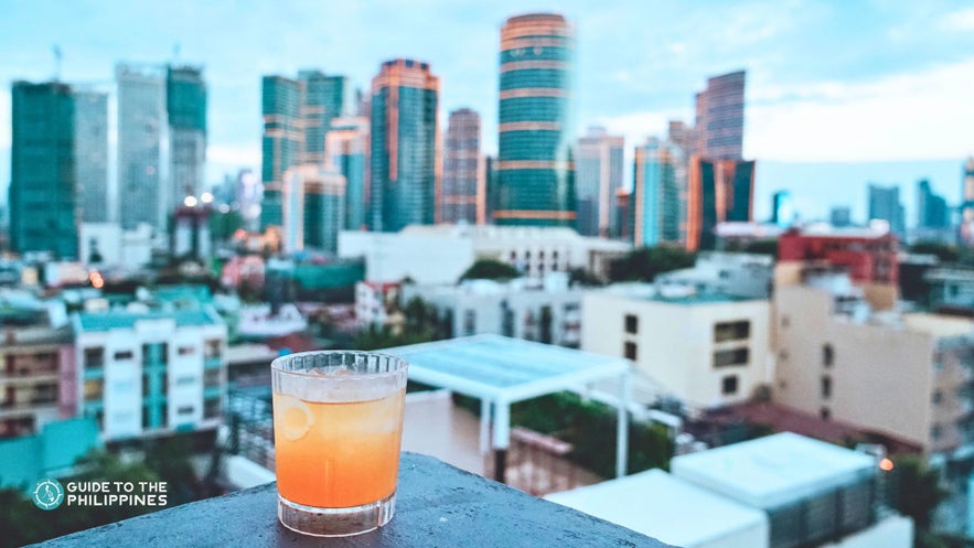 Drinking with a view at a rooftop bar in Makati City Drinking with a view at a rooftop bar in Makati City