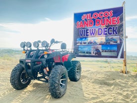 Explore the rugged landscape of the Paoay Sand Dunes on a 4x4 vehicle