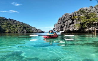 Paddle through the turquoise waters of Barracuda Lake during a sunrise kayak in Coron town.