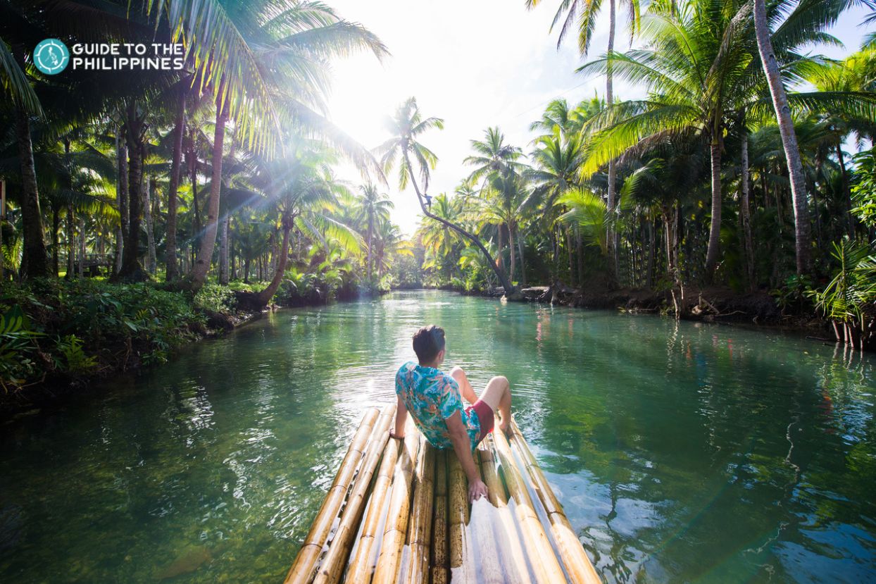A traveler cruising along Maasin River on Siargao Island.