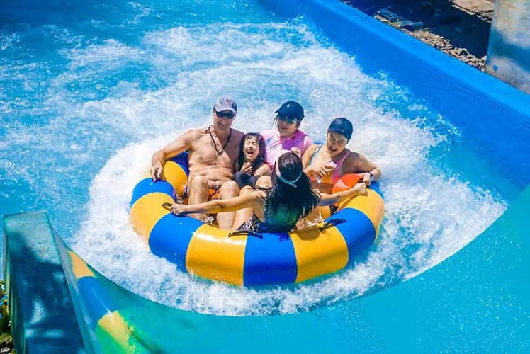 A family enjoying the fun-filled rides and attractions at Splash Island Waterpark in Laguna Province