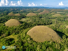 A scenic view of the Chocolate Hills, a highlight in this tour package at Bohol Island.