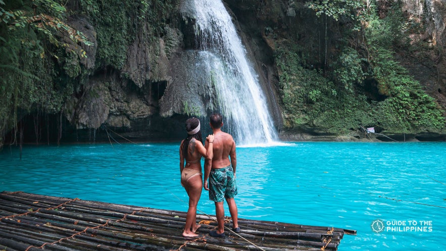 Couple in Kawasan Falls of Cebu Island Couple in Kawasan Falls of Cebu Island