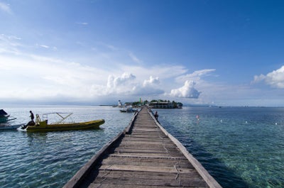 Experience the cold turquoise waters of Tumalog Falls