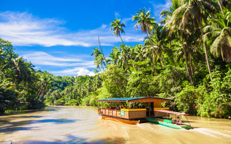 Go on a relaxing Loboc River cruise in Bohol island with this during this 12-Day Visayas Island Region tour package