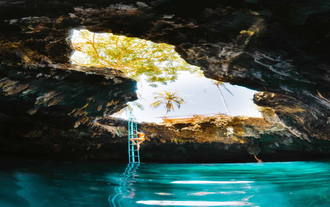Take a refreshing dip in the crystal-clear waters of Cabagnow Cave Pool, an unforgettable stop on this private tour to Bohol Island
