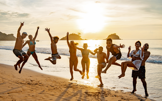 Tourists enjoying a stunning sunset view at El Nido town beach during this Palawan Island adventure
