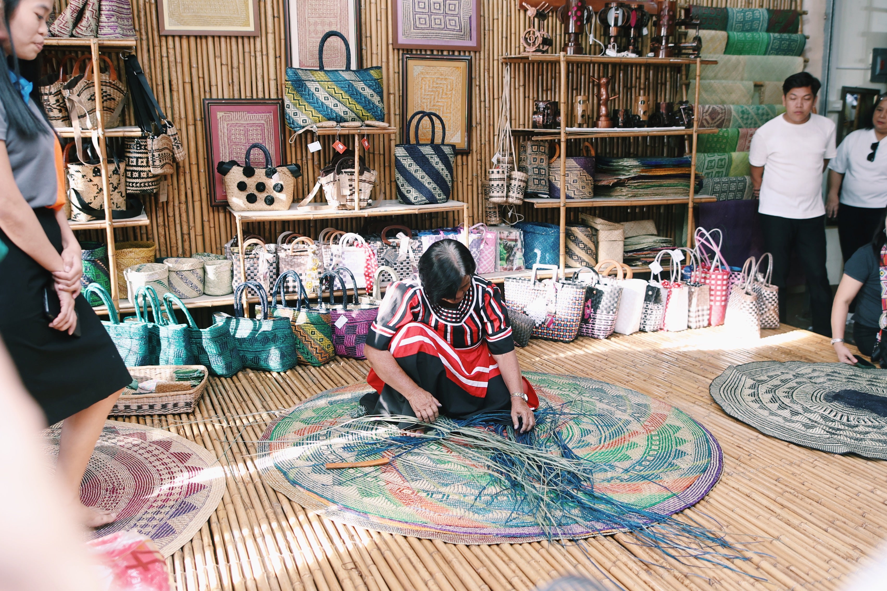 A local artisan demonstrating tradionatl weaving at the Tagolwanen Women Weavers Center.