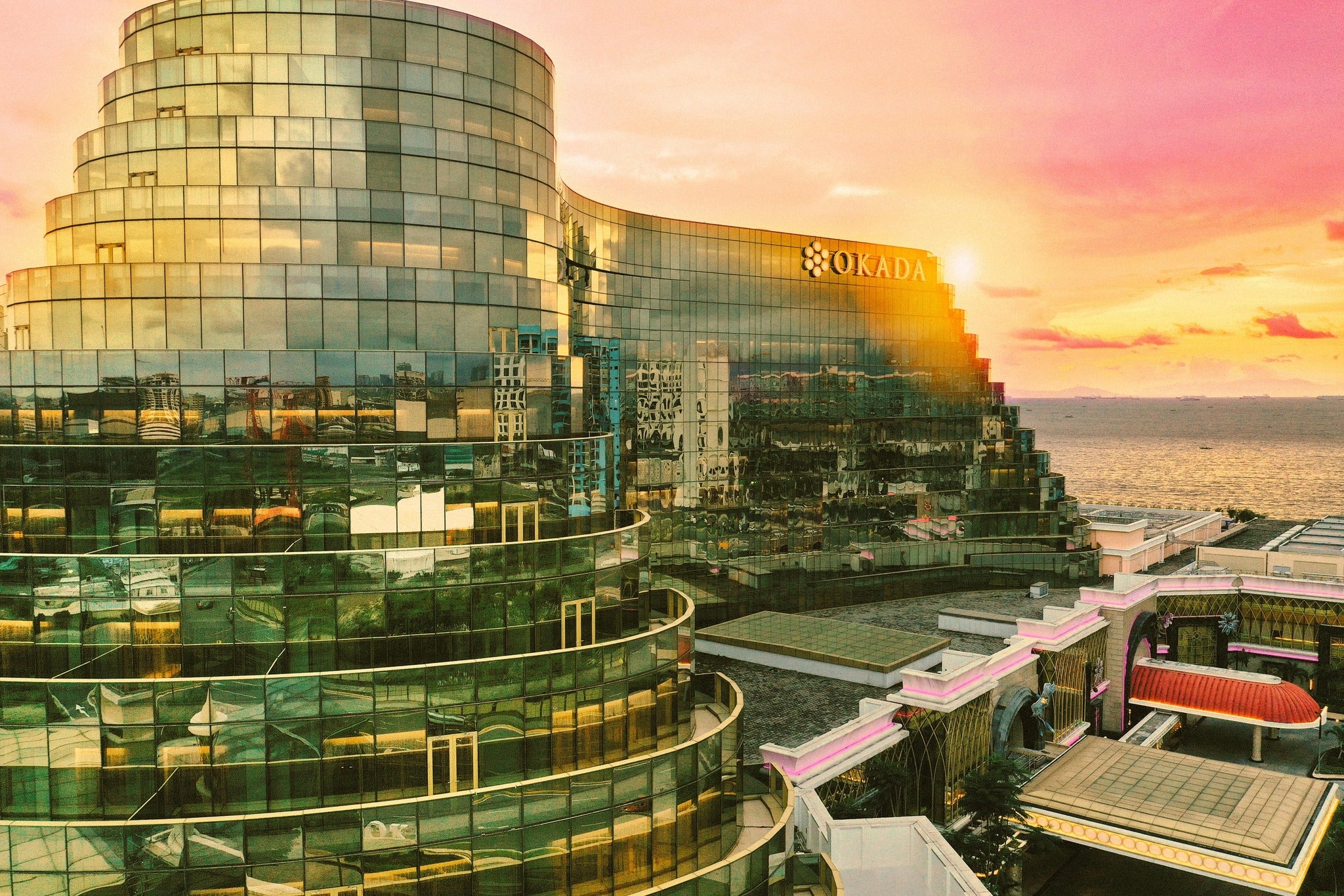 Okada Manila&rsquo;s grand facade, showcasing its striking architecture and iconic design.